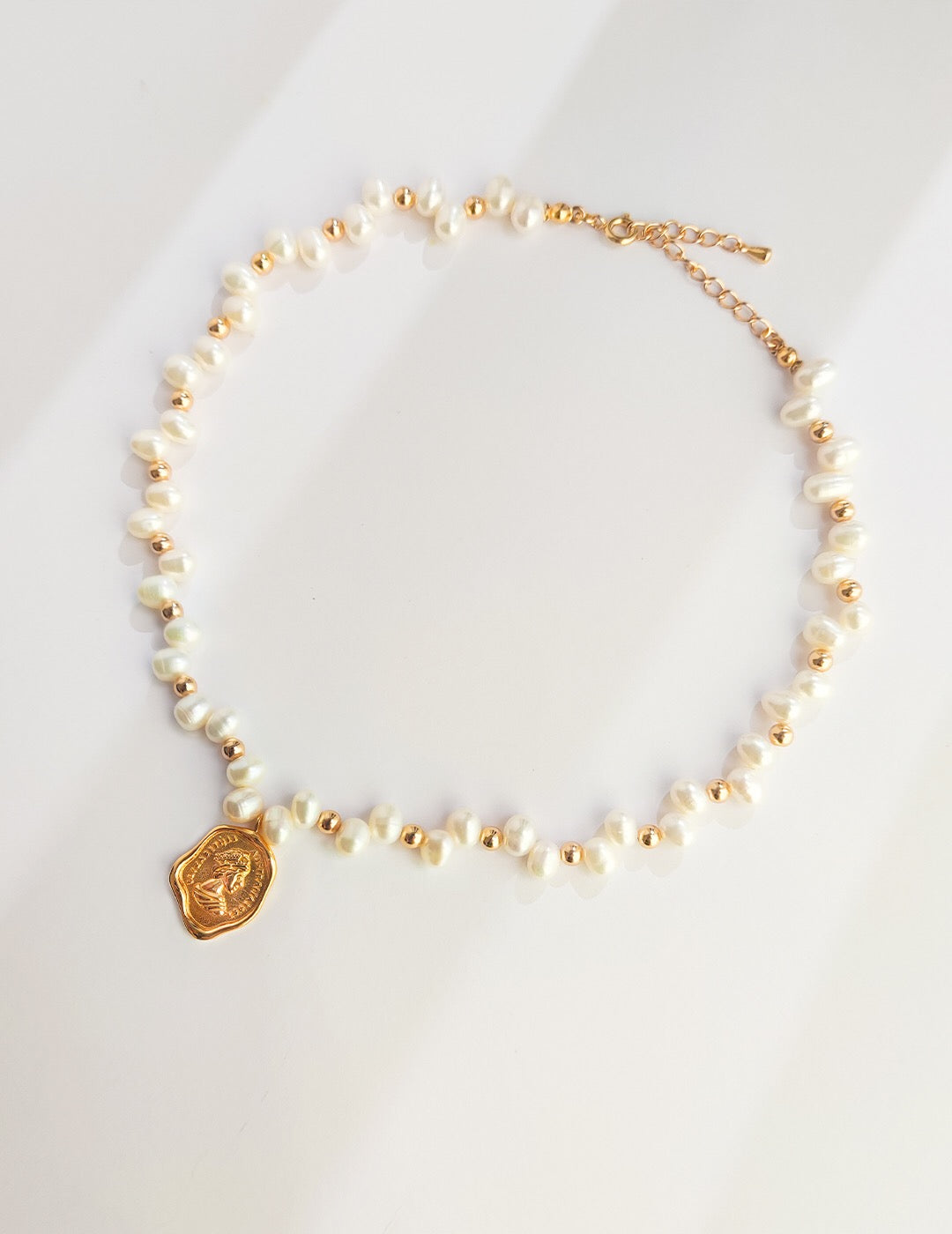 Wax Seal Queen Necklace featuring natural pearls and gold vermeil, elegantly designed with a unique pendant.