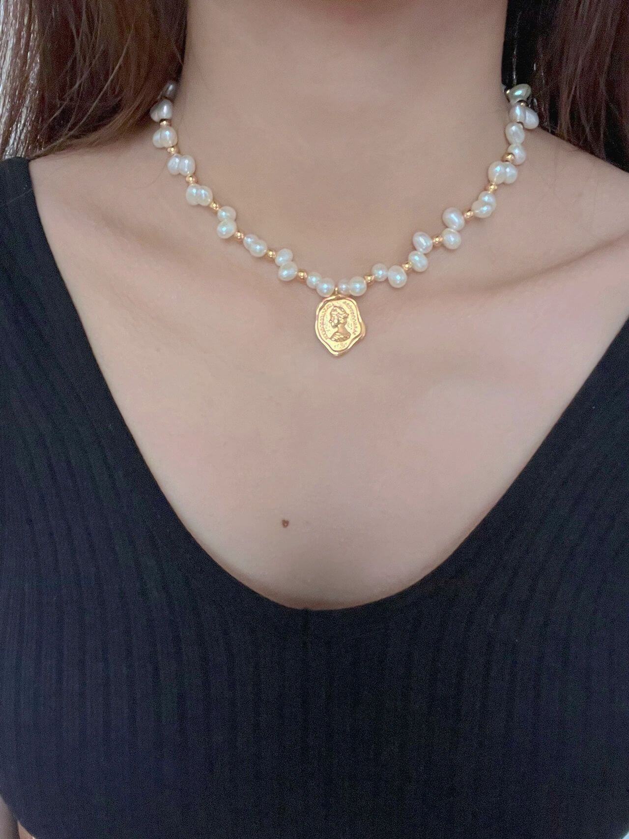 Wax Seal Queen Necklace featuring natural pearls and gold vermeil, elegantly designed with a unique pendant.