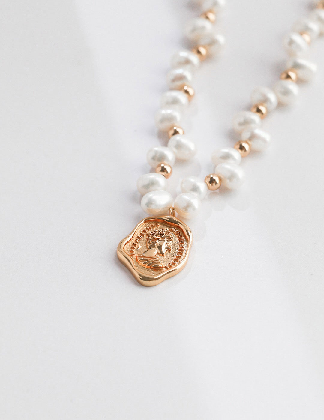 Wax Seal Queen Necklace featuring natural pearls and gold vermeil, elegantly designed with a unique pendant.