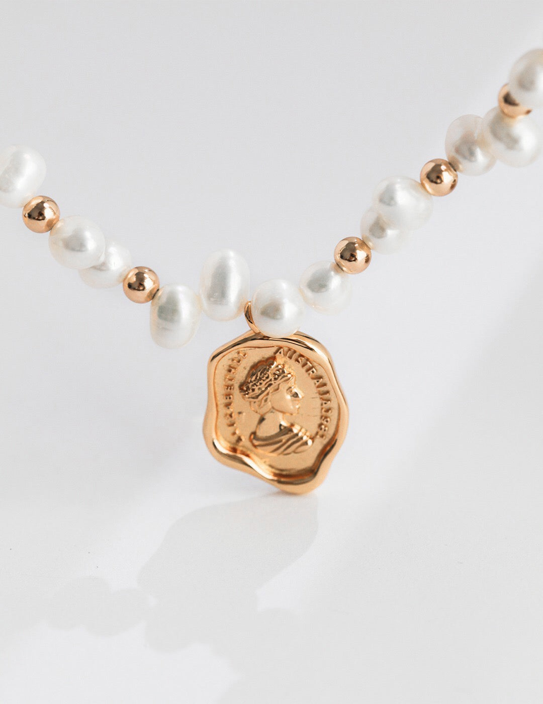 Wax Seal Queen Necklace featuring natural pearls and gold vermeil, elegantly designed with a unique pendant.