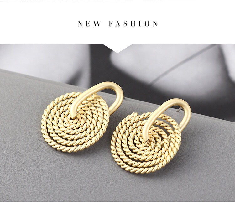 A pair of elegant Weaving Disc Earrings made from brass and s925 silver, featuring a unique weaving pattern.