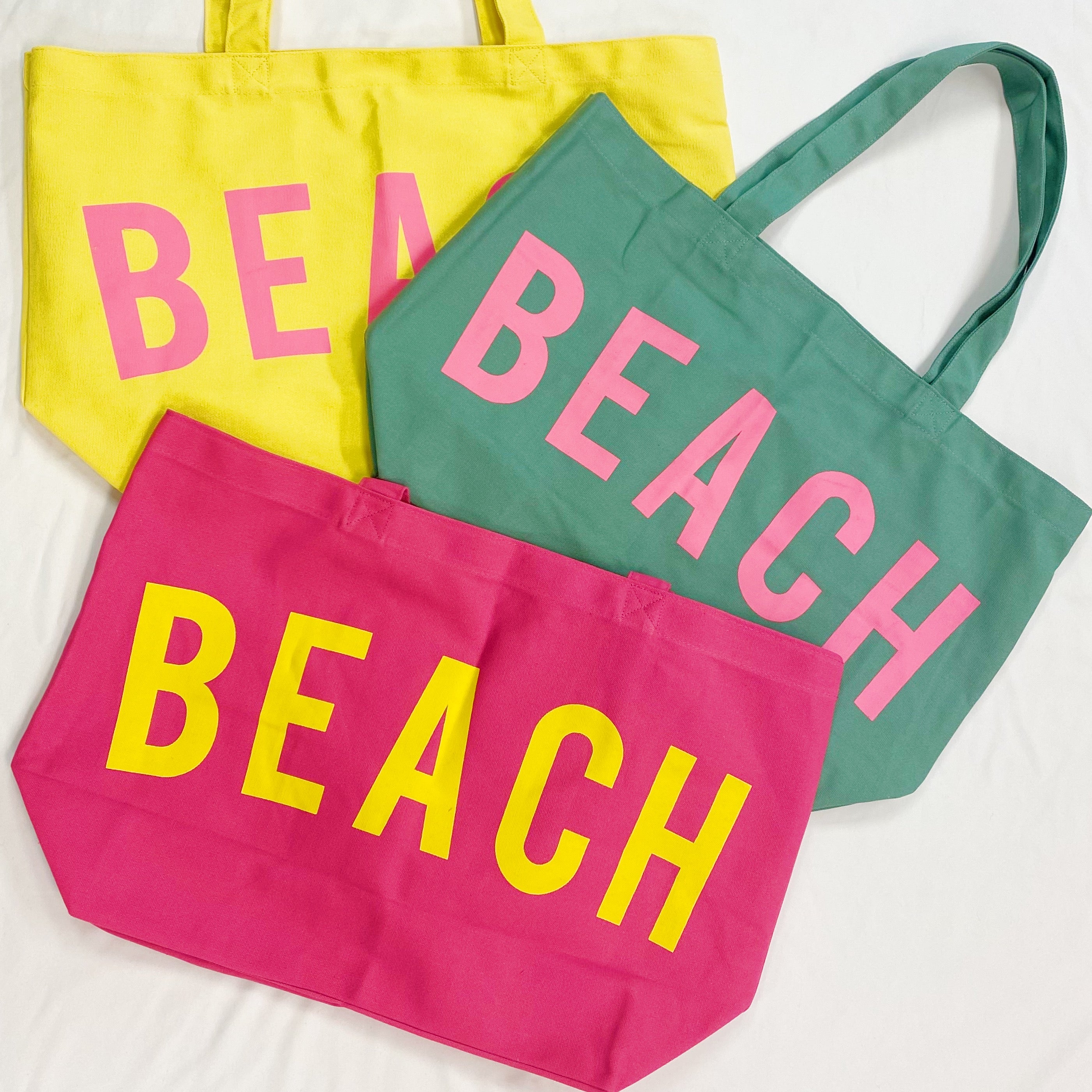 Well Made Beach Canvas Tote in vibrant colors with large pockets, perfect for beach outings.