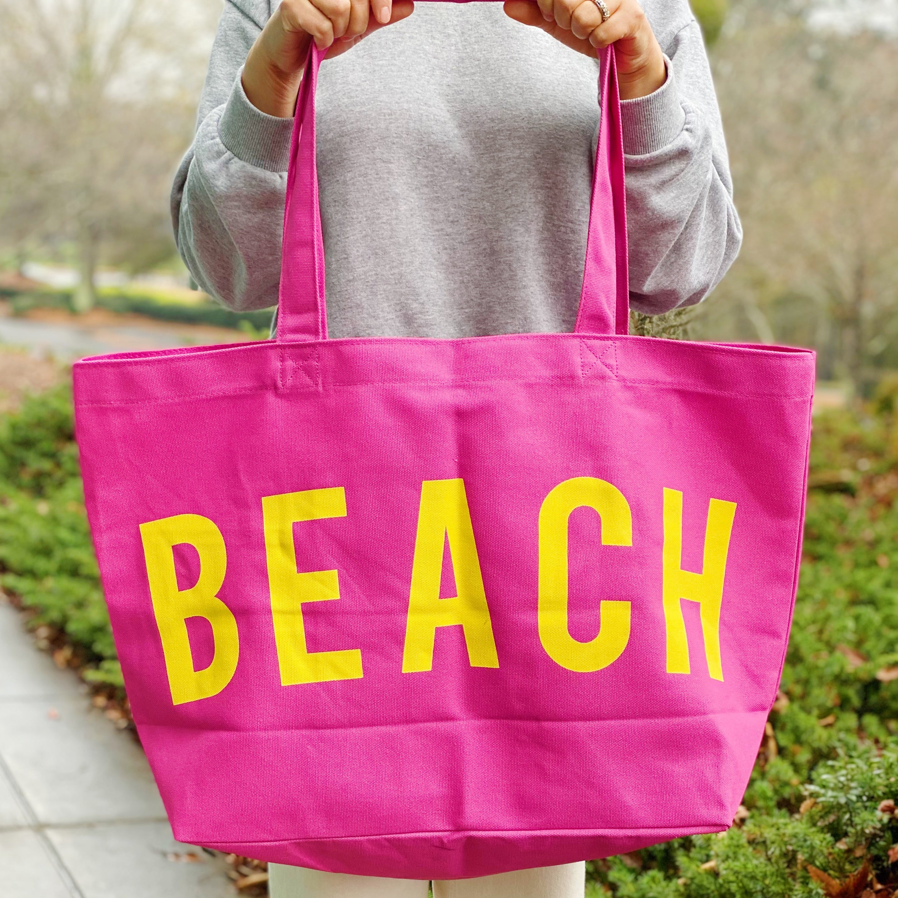 Well Made Beach Canvas Tote in vibrant colors with large pockets, perfect for beach outings.