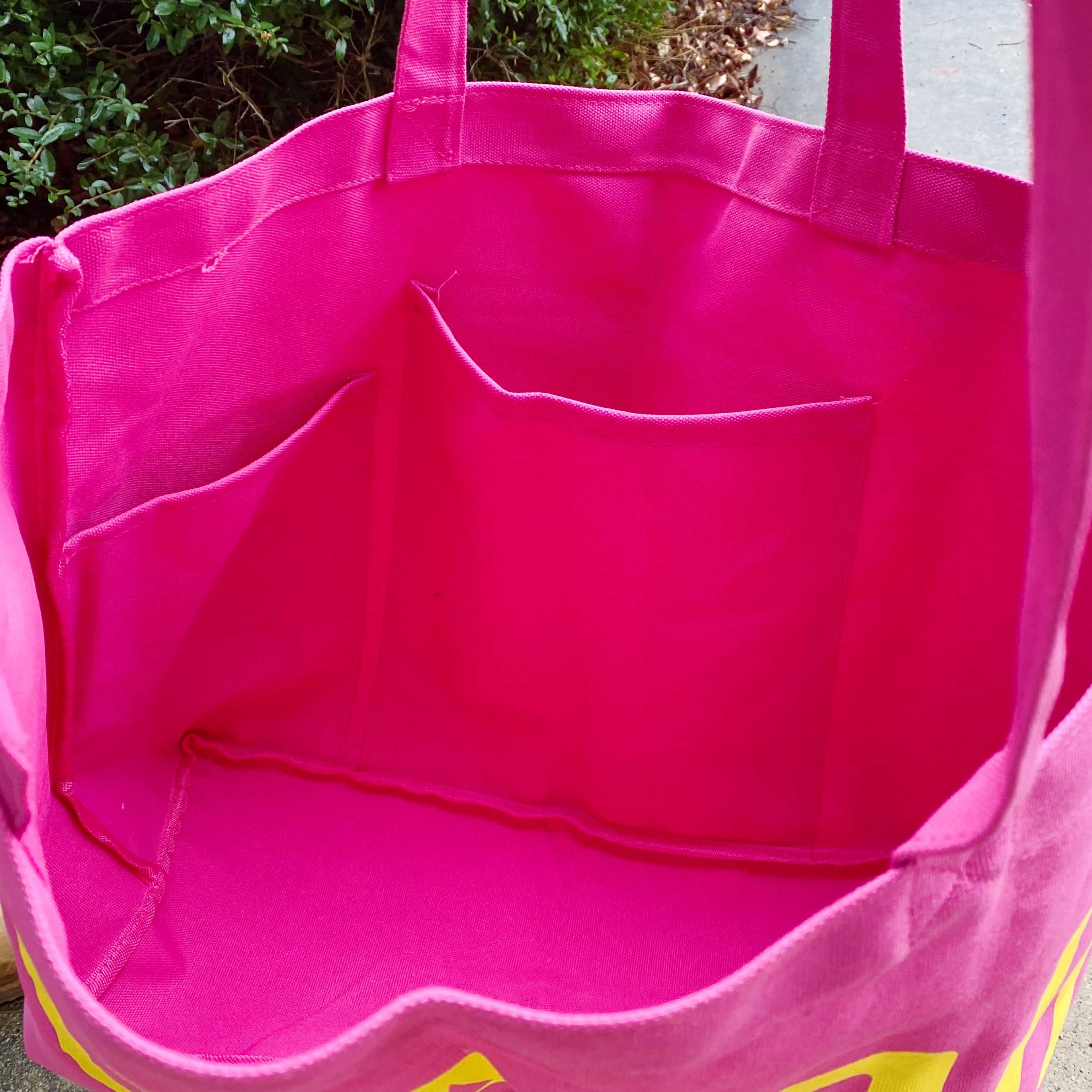 Well Made Beach Canvas Tote in vibrant colors with large pockets, perfect for beach outings.