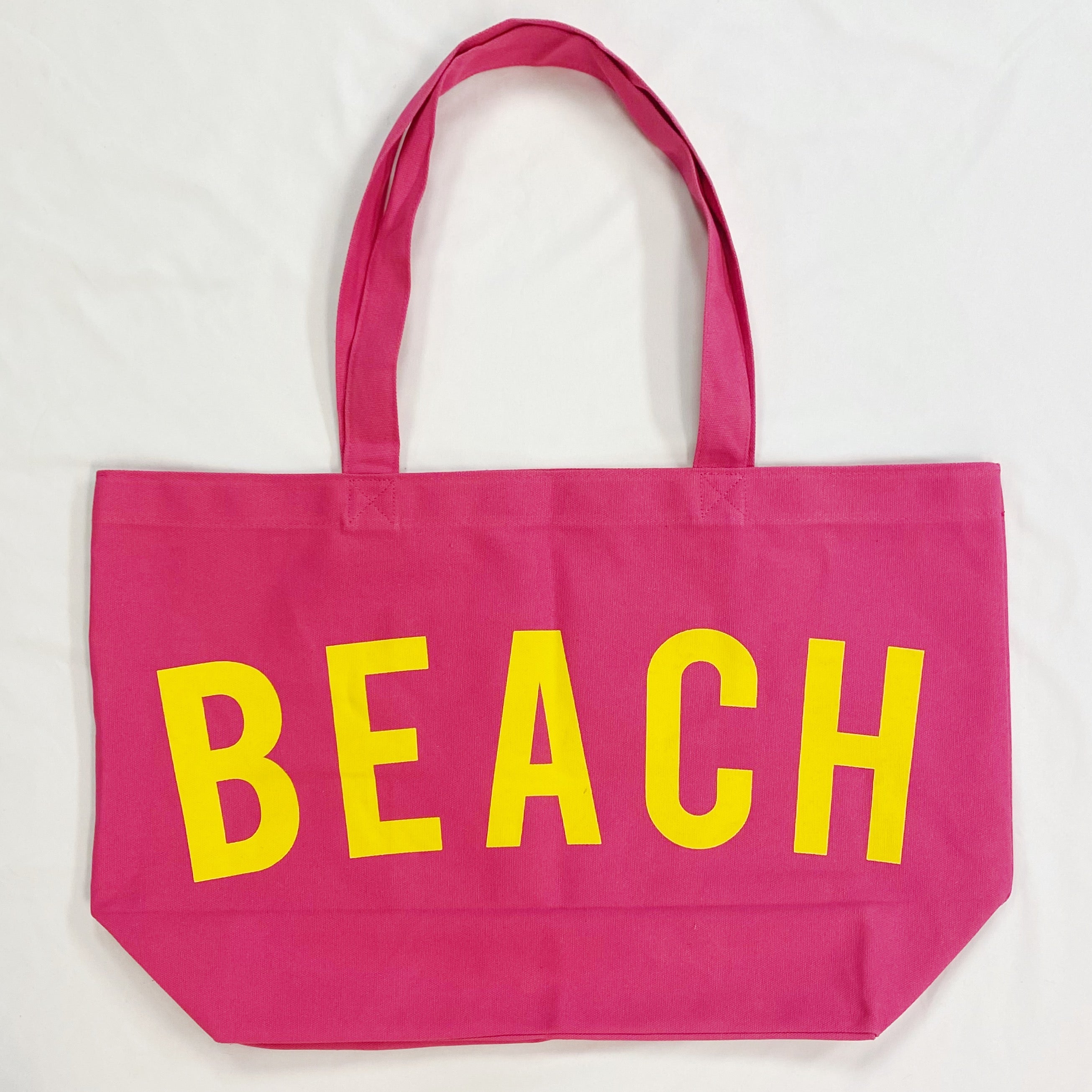 Well Made Beach Canvas Tote in vibrant colors with large pockets, perfect for beach outings.