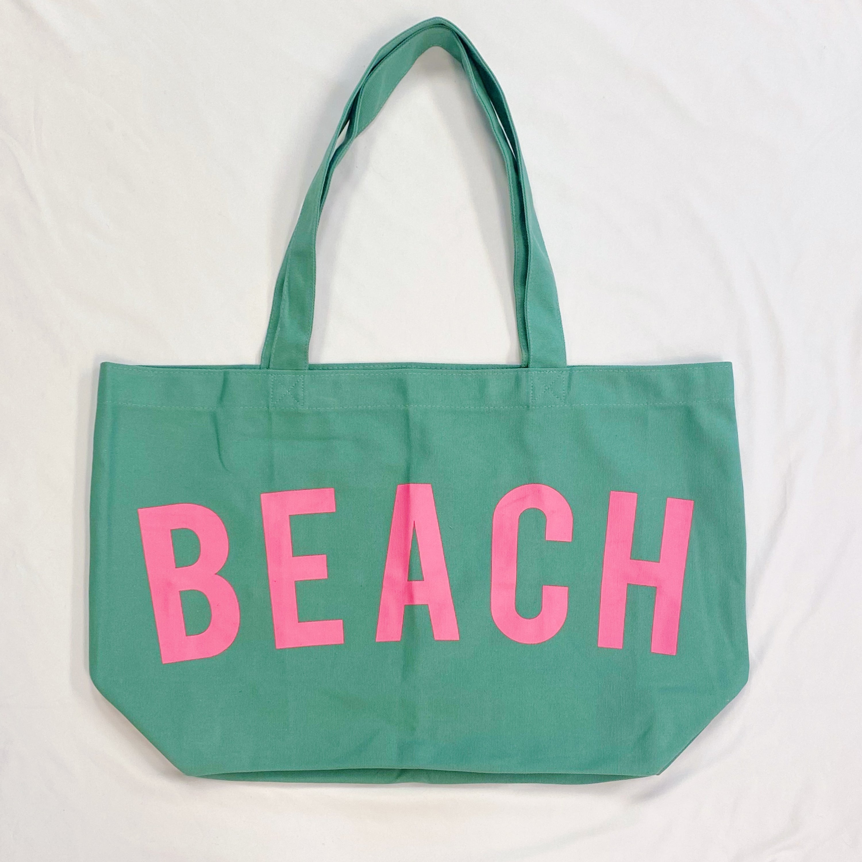 Well Made Beach Canvas Tote in vibrant colors with large pockets, perfect for beach outings.