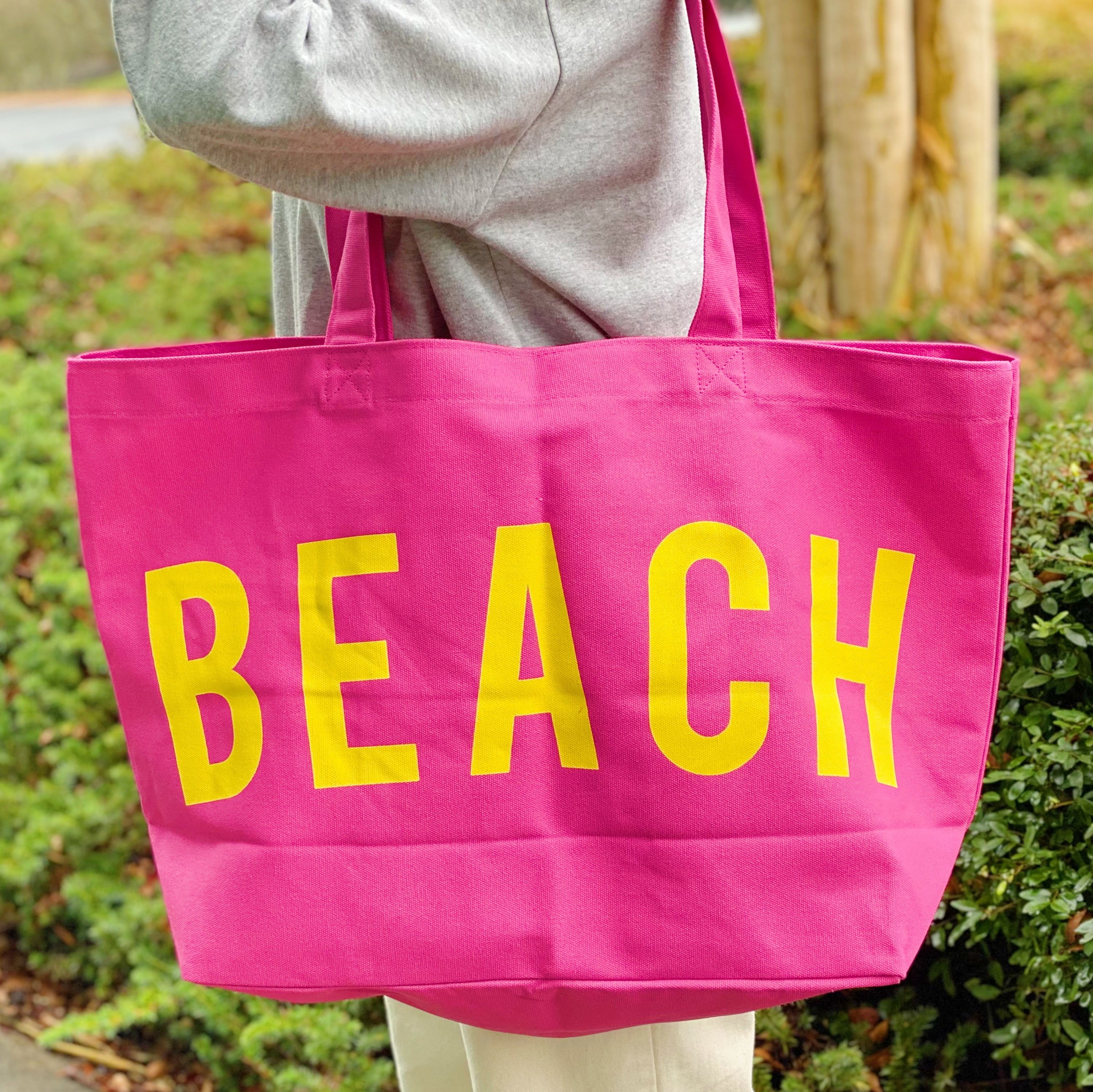 Well Made Beach Canvas Tote in vibrant colors with large pockets, perfect for beach outings.