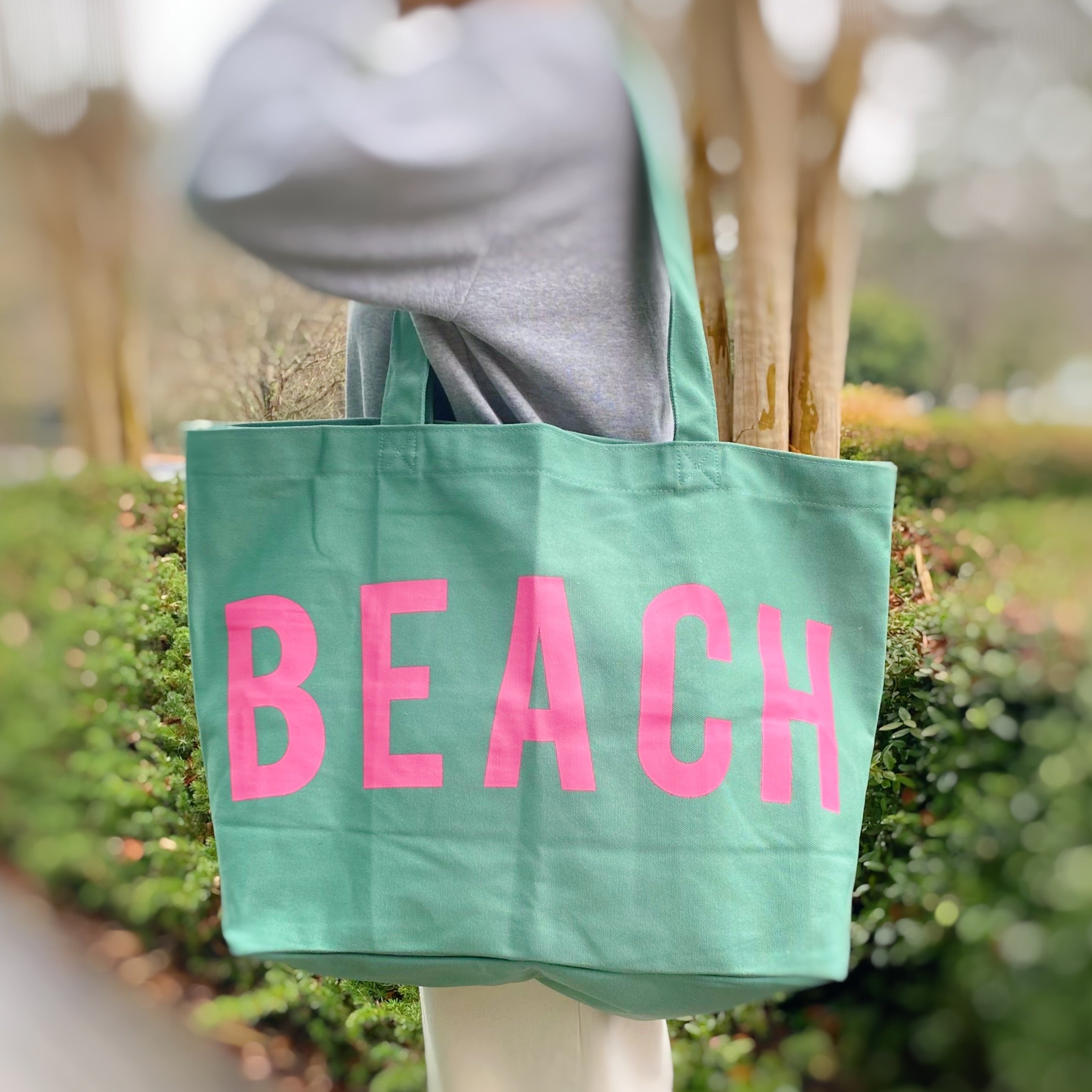 Well Made Beach Canvas Tote in vibrant colors with large pockets, perfect for beach outings.