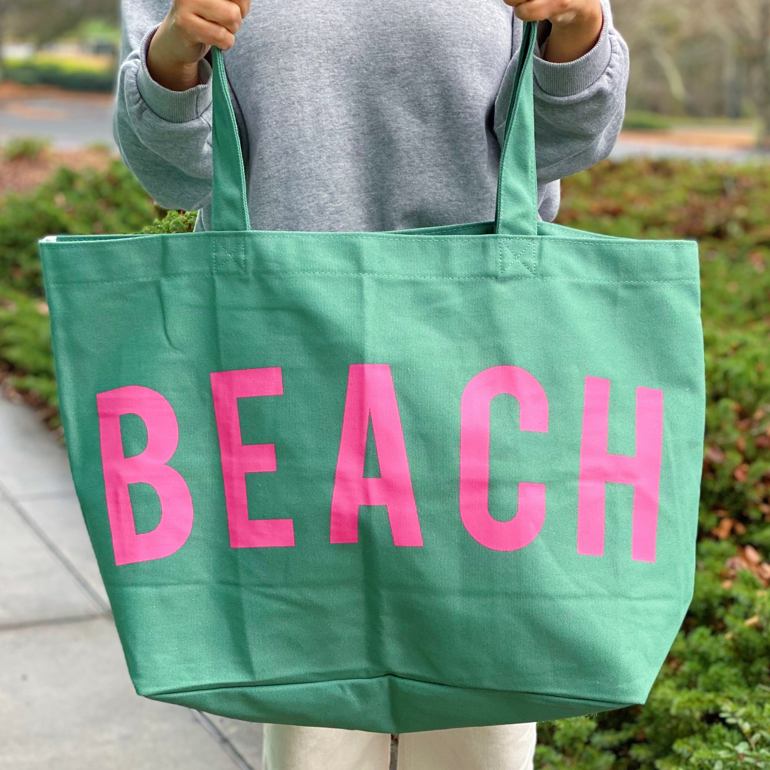 Well Made Beach Canvas Tote in vibrant colors with large pockets, perfect for beach outings.