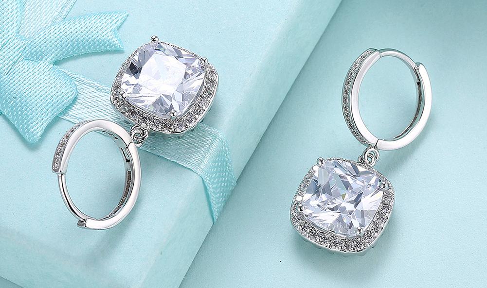 Elegant White Austrian Asscher Cut Dangling Lever Back Earrings in 14K White Gold, showcasing their brilliant sparkle and unique design.