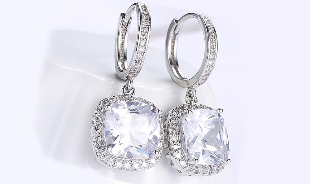 Elegant White Austrian Asscher Cut Dangling Lever Back Earrings in 14K White Gold, showcasing their brilliant sparkle and unique design.