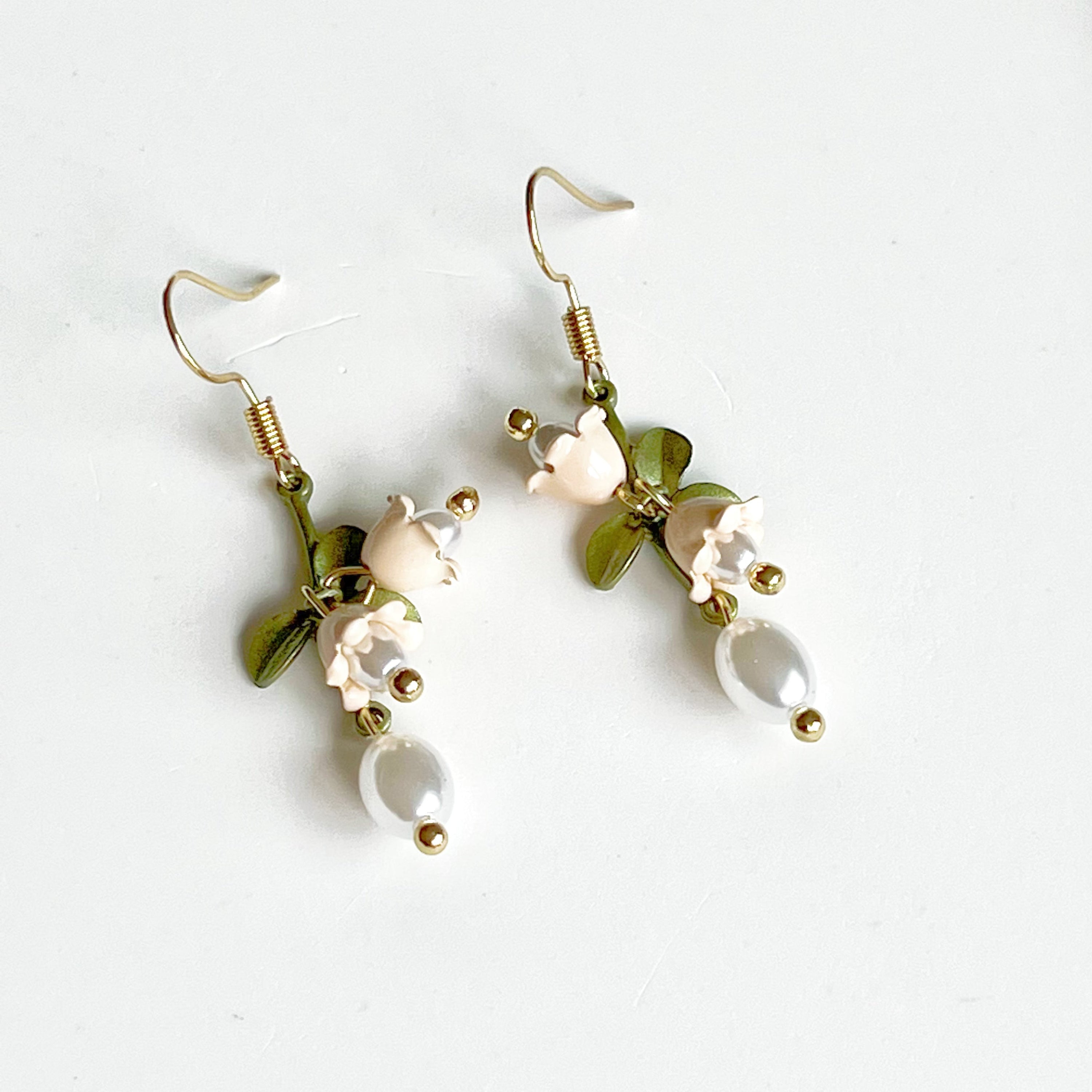 Elegant White Bellflower Little Drop Earrings with green leaves, symbolizing everlasting love, displayed in a gift box.