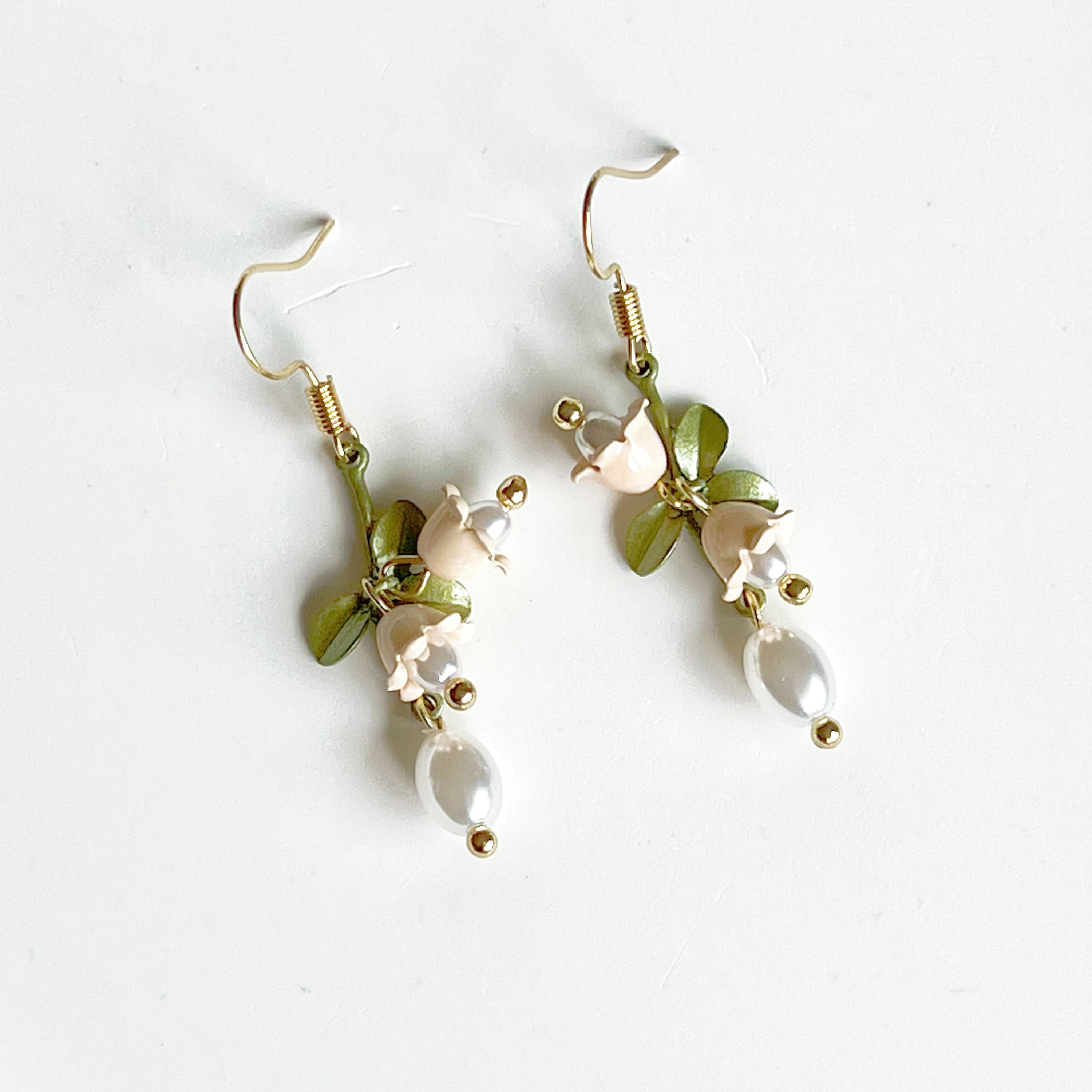 Elegant White Bellflower Little Drop Earrings with green leaves, symbolizing everlasting love, displayed in a gift box.