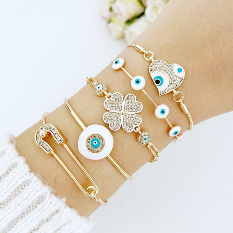 A stylish White Evil Eye Bracelet featuring a zircon charm, crafted from tarnish-resistant 316L stainless steel in a gold color.