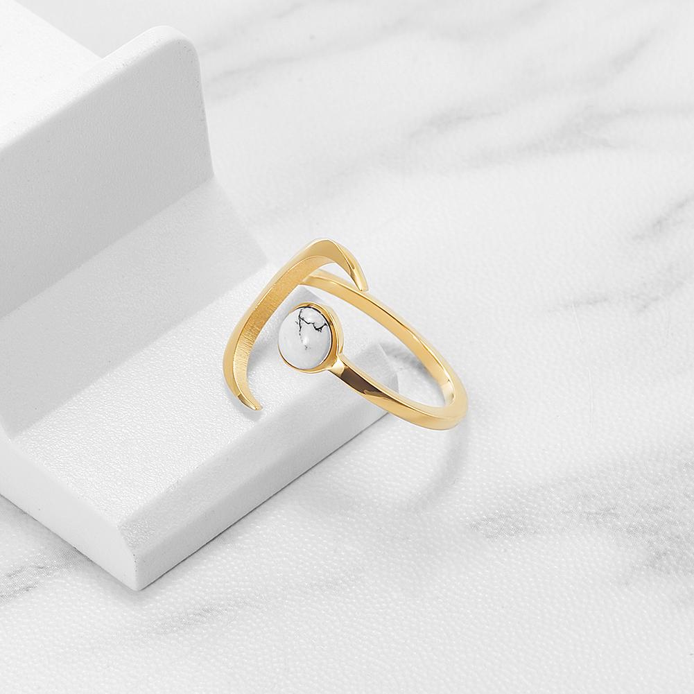 Elegant White Marble Moon Ring made of stainless steel with gold plating, featuring a unique marble design.