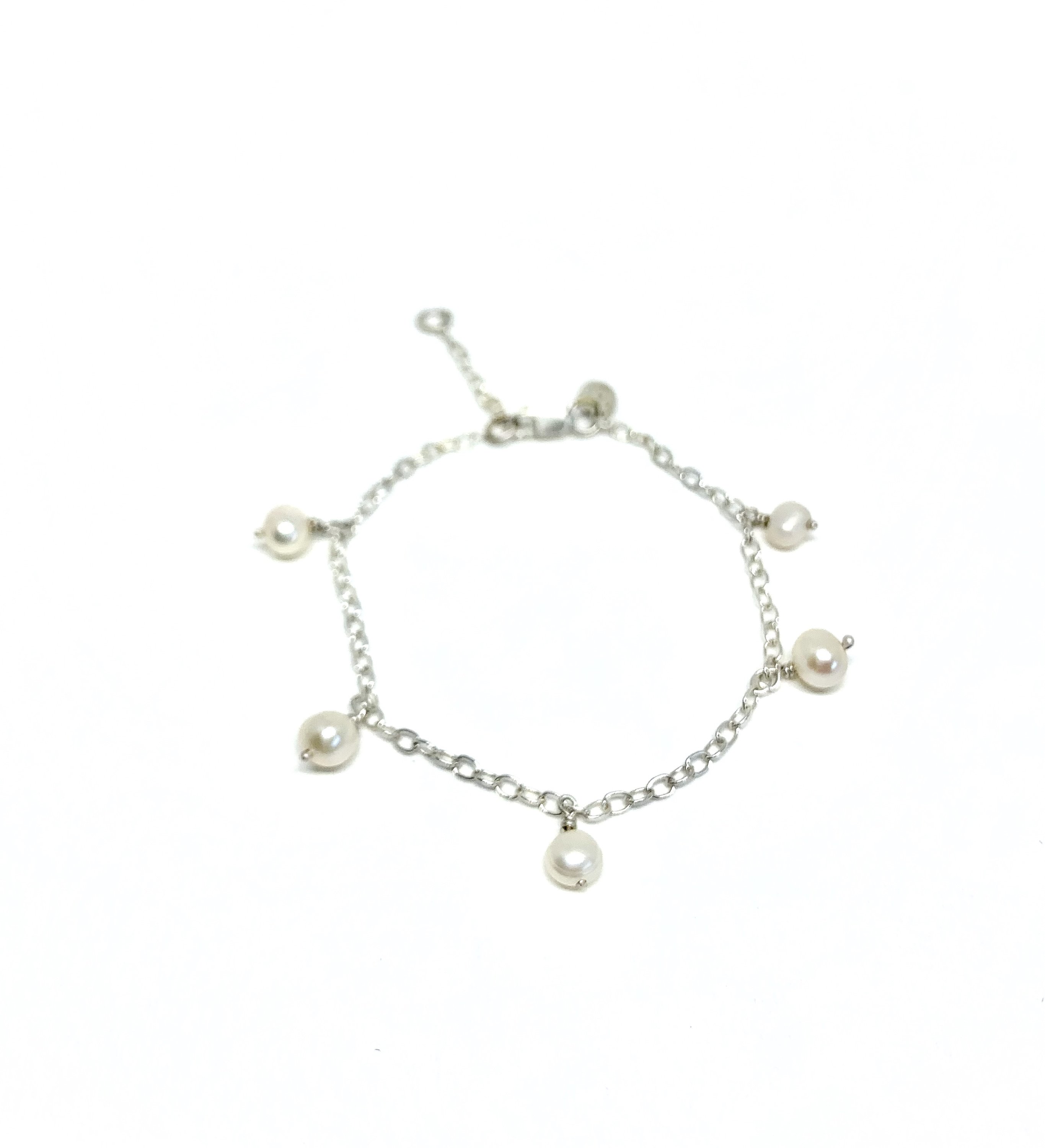 Elegant White Pearl Bracelet featuring five freshwater pearls on a delicate cable chain, perfect for any occasion.