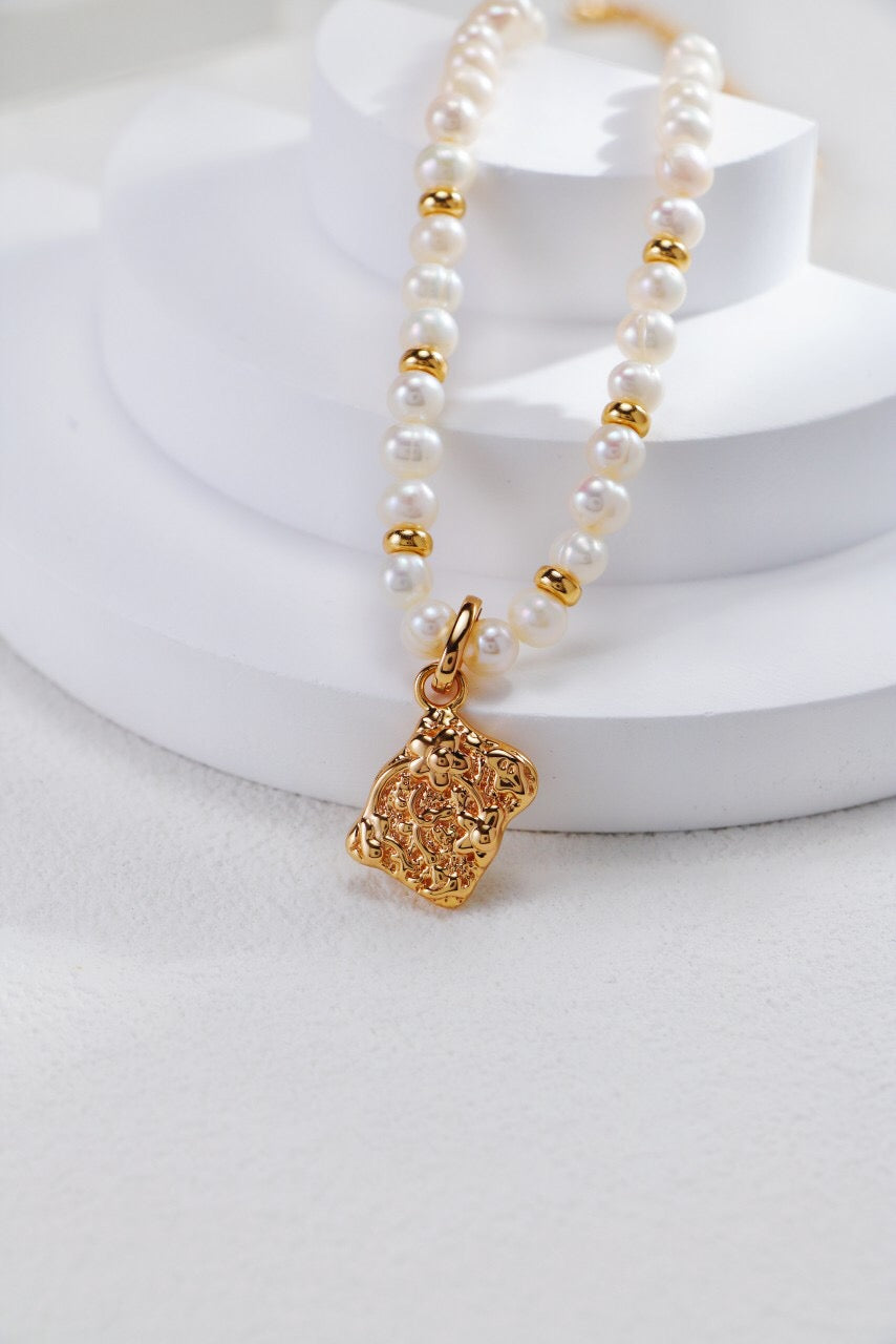 Elegant White Shell Double Sided Pendant Necklace with gold vermeil accents, showcasing its unique design and craftsmanship.