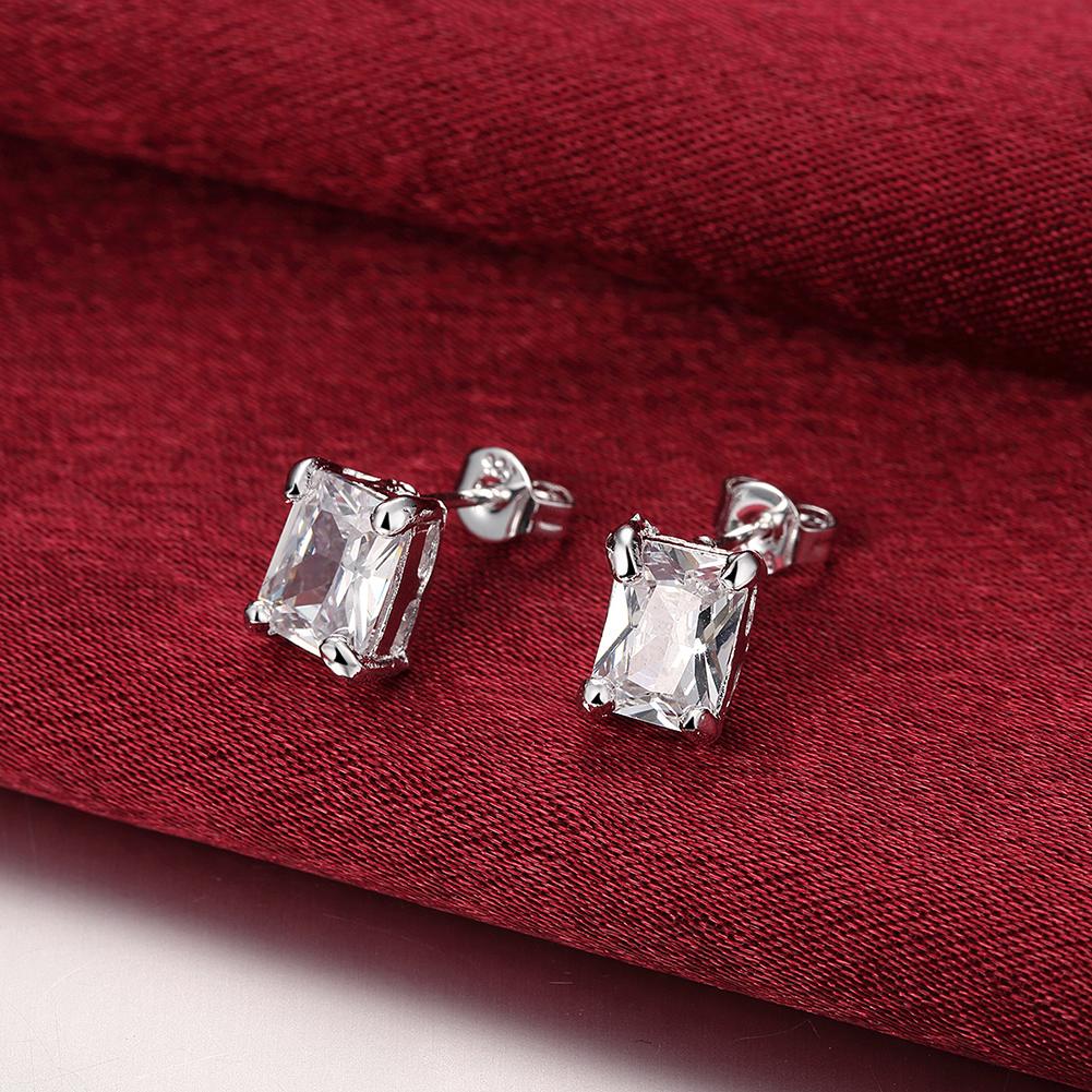 Elegant White Topaz Square Stud Earrings set in 14K white gold plating, showcasing a modern square design.