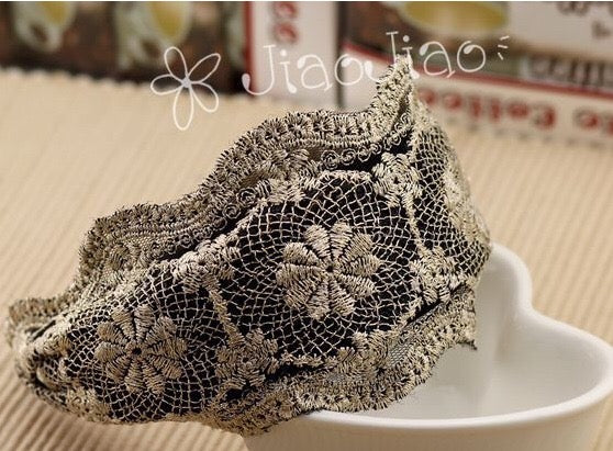 A collection of wide lace hair bands in various colors, showcasing their elegant design and lightweight fabric.