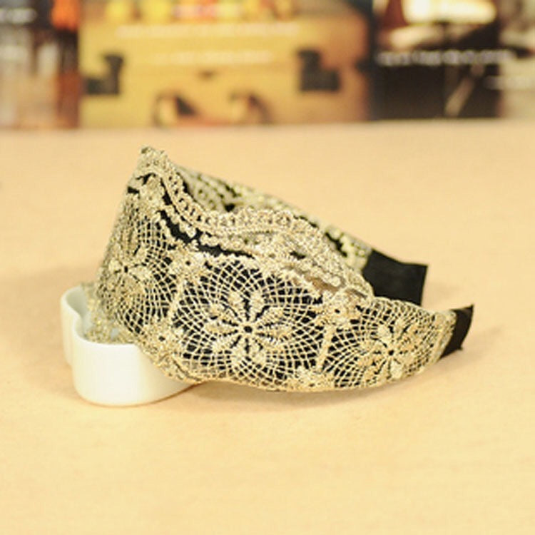 A collection of wide lace hair bands in various colors, showcasing their elegant design and lightweight fabric.