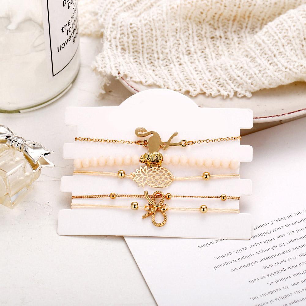 Wild Jungle Marble Stretch 5 Piece Bracelet Set featuring 14K rose gold plating and unique pineapple design, elegantly displayed.