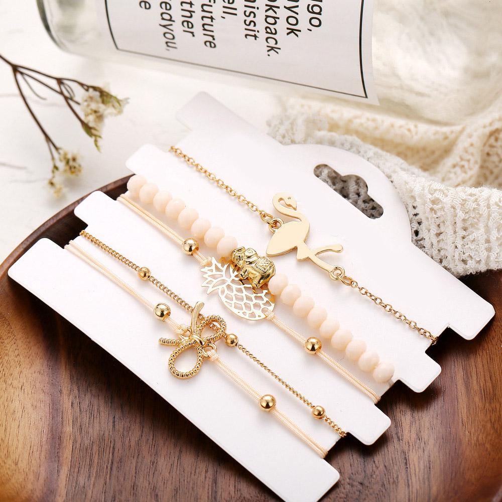 Wild Jungle Marble Stretch 5 Piece Bracelet Set featuring 14K rose gold plating and unique pineapple design, elegantly displayed.