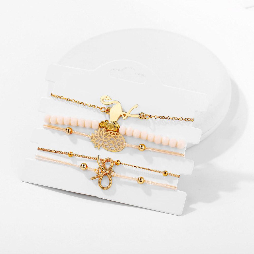 Wild Jungle Marble Stretch 5 Piece Bracelet Set featuring 14K rose gold plating and unique pineapple design, elegantly displayed.