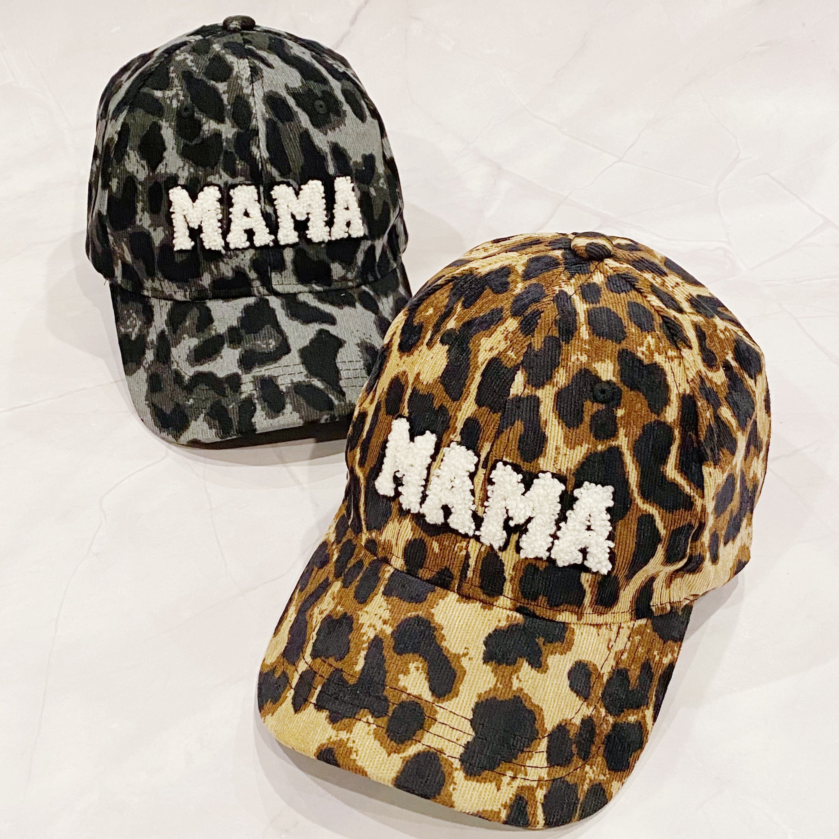 Wild Mama Corduroy Ball Cap featuring playful animal print and fuzzy lettering, adjustable strap, and hidden pocket for a sleek look.