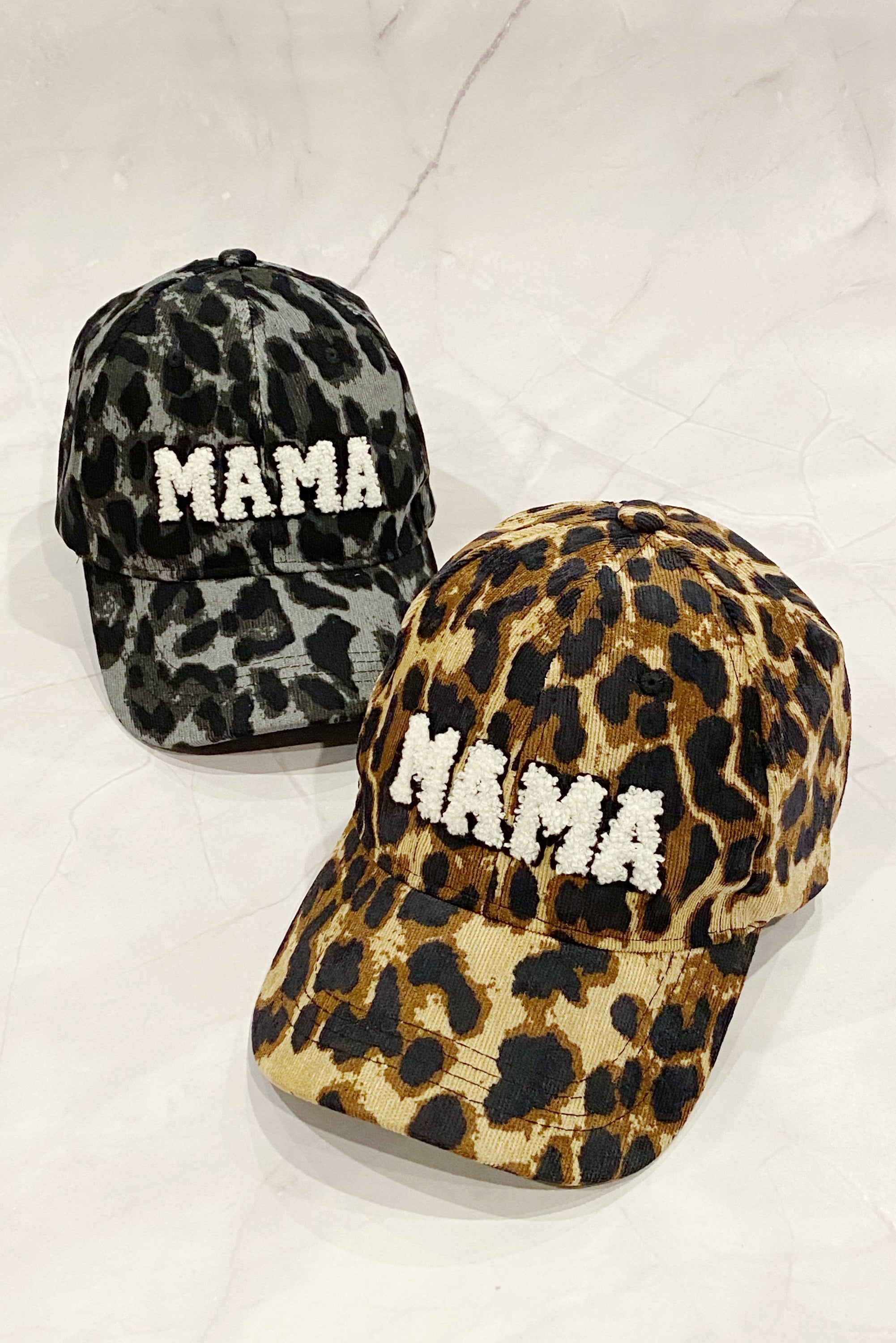 Wild Mama Corduroy Ball Cap featuring playful animal print and fuzzy lettering, adjustable strap, and hidden pocket for a sleek look.