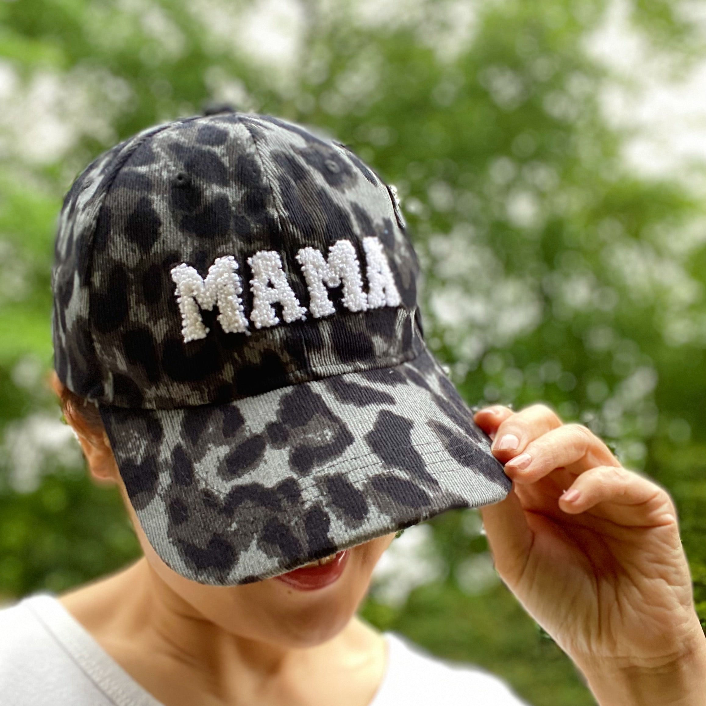 Wild Mama Corduroy Ball Cap featuring playful animal print and fuzzy lettering, adjustable strap, and hidden pocket for a sleek look.