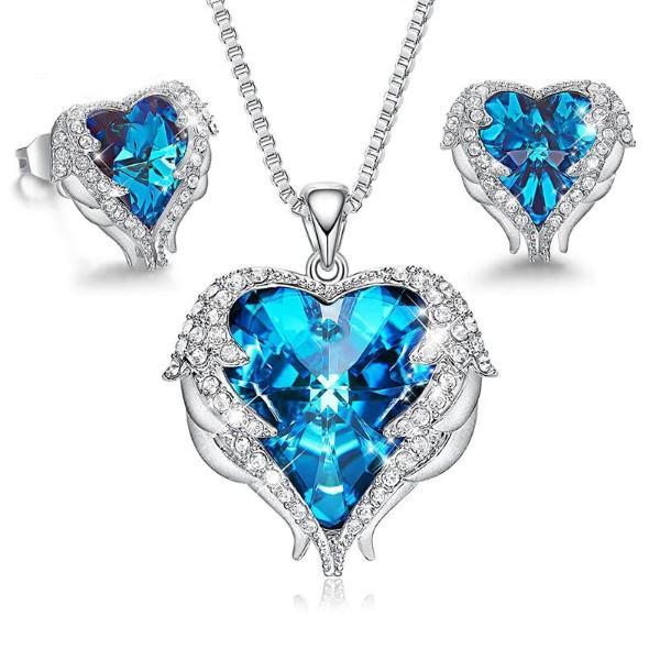 Wings of an Angel Heart Blue Topaz Necklace and Earring Set featuring 18K white gold plating and Austrian crystals, elegantly displayed.