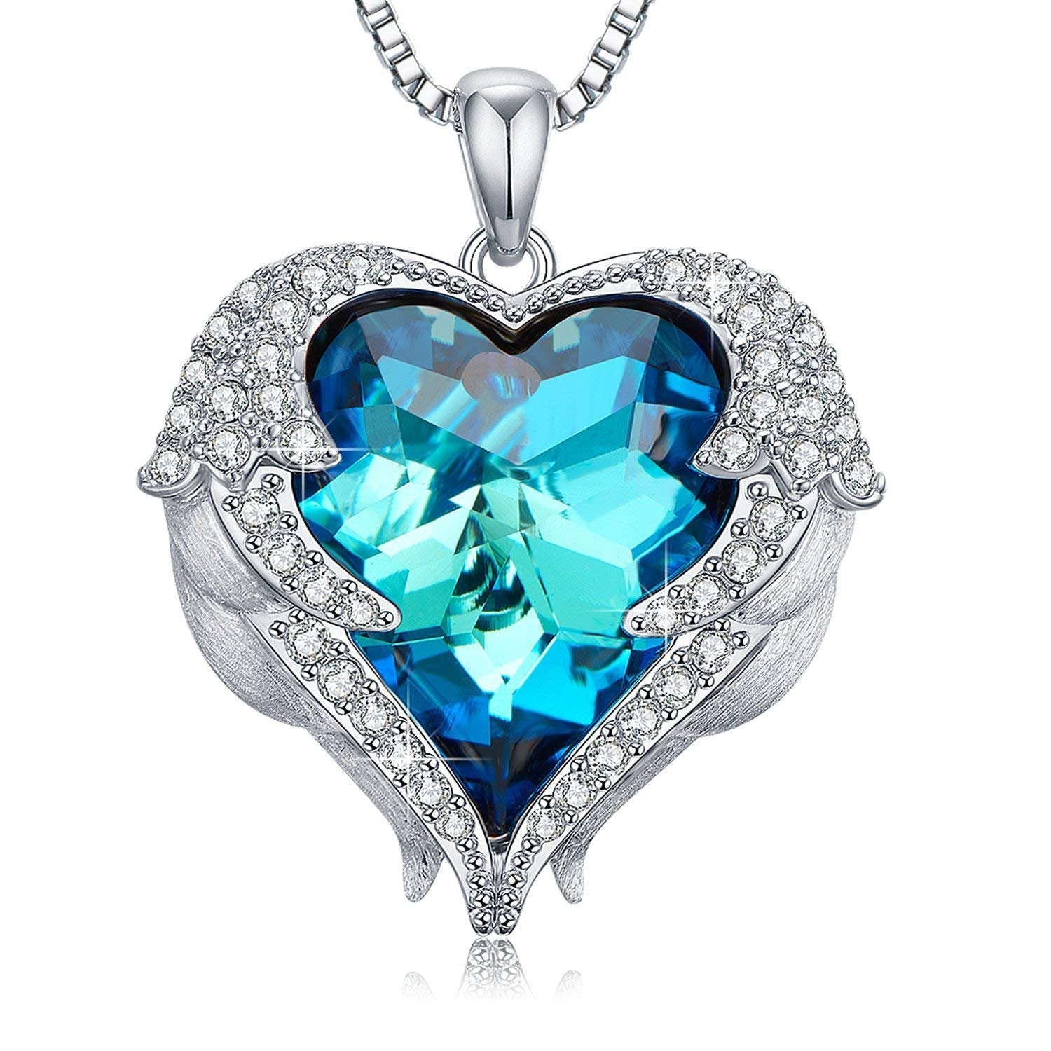 Wings of an Angel Heart Blue Topaz Necklace and Earring Set featuring 18K white gold plating and Austrian crystals, elegantly displayed.