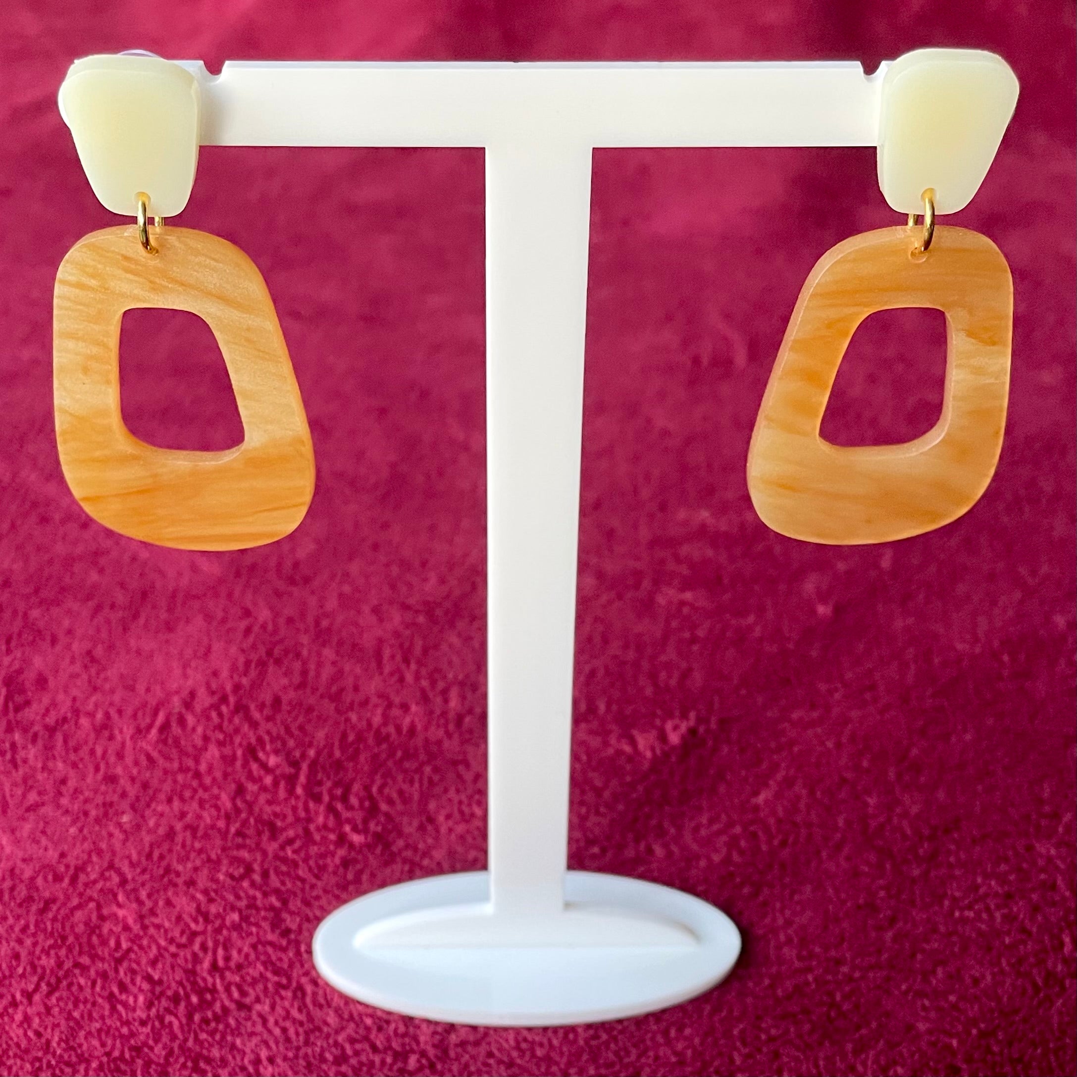 Winnie Earrings featuring caramel marble and ivory toppers, showcasing a stylish laser cut acrylic design.