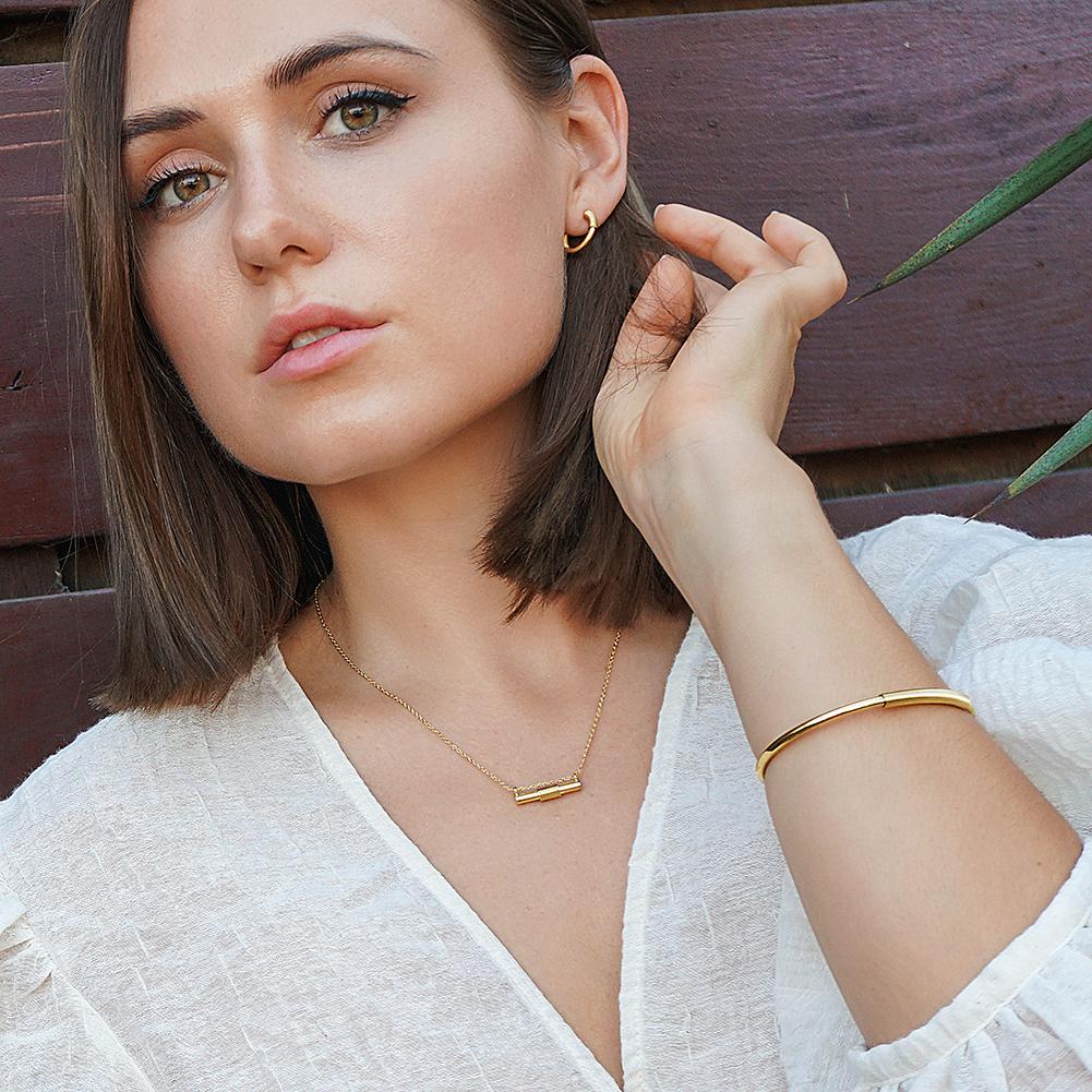 Wire Set featuring a mini bar necklace, tiny hoop earrings, and a cuff bangle in 14k gold over stainless steel, elegantly displayed in a gift box.