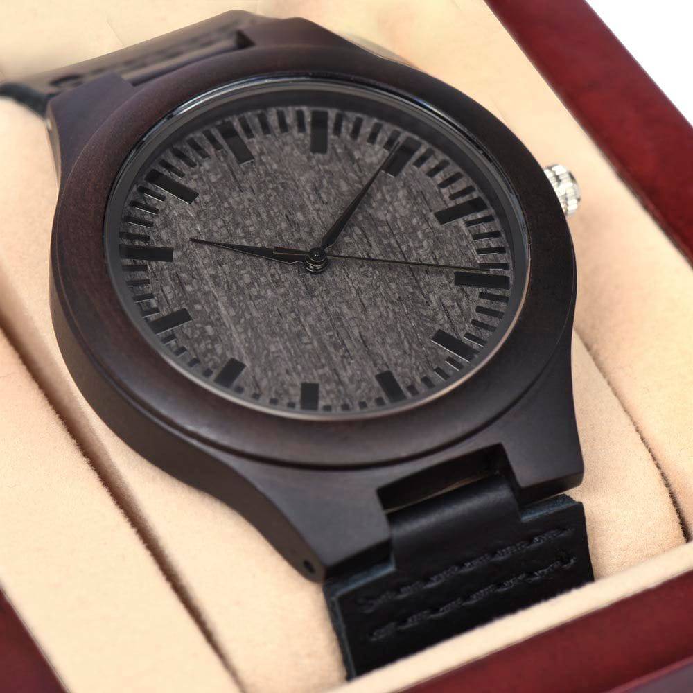 A stylish Wooden Watch made from rich sandalwood with a genuine black leather strap, showcasing unique wood grain patterns.