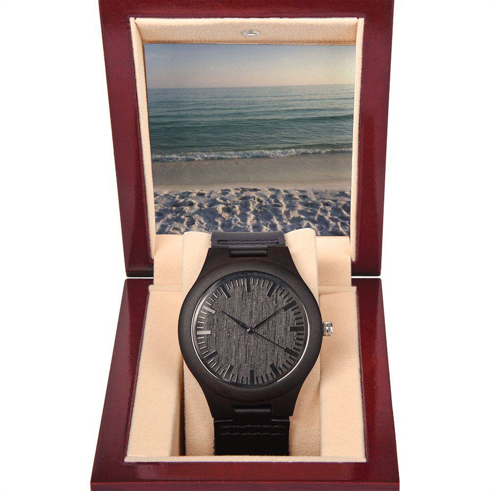 A stylish Wooden Watch made of sandalwood with a black leather strap, showcasing its unique wood grain and elegant design.