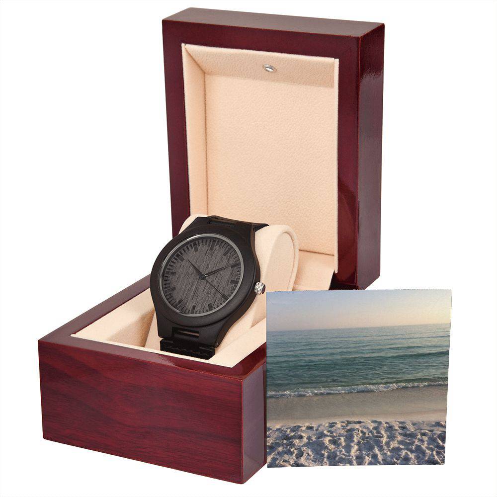 A stylish Wooden Watch made of sandalwood with a black leather strap, showcasing its unique wood grain and elegant design.