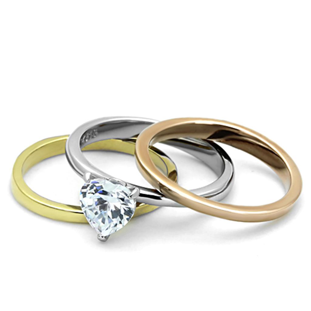 Elegant three-tone stainless steel ring with cubic zirconia stones, showcasing a polished finish.