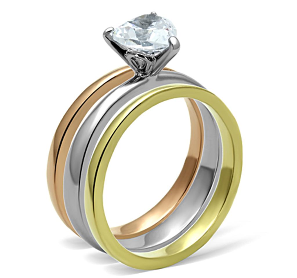 Elegant three-tone stainless steel ring with cubic zirconia stones, showcasing a polished finish.