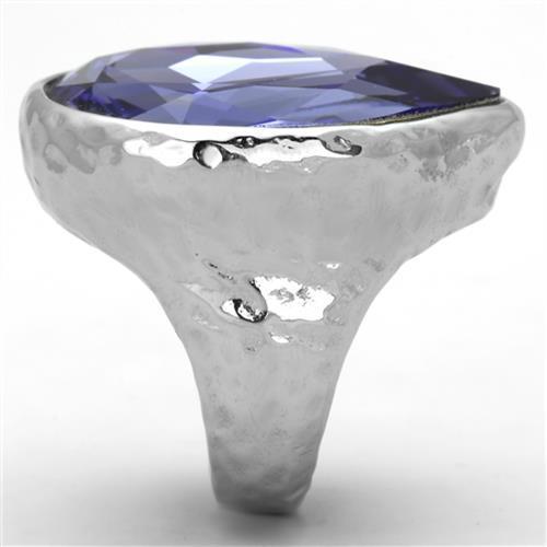 A stylish women's stainless steel ring featuring a high polished finish and a synthetic crystal tanzanite in a pear shape.