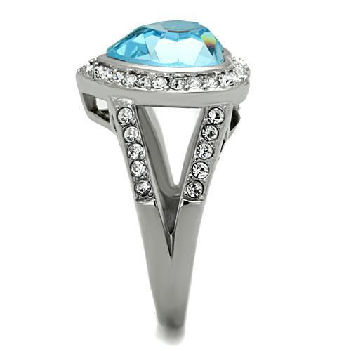 A beautiful women’s stainless steel ring featuring a sea blue synthetic crystal, showcasing a high polished finish.