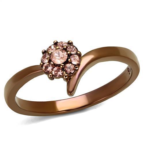 A stylish women's ring made of stainless steel featuring a light peach synthetic crystal, showcasing elegance and durability.