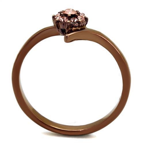 A stylish women's ring made of stainless steel featuring a light peach synthetic crystal, showcasing elegance and durability.