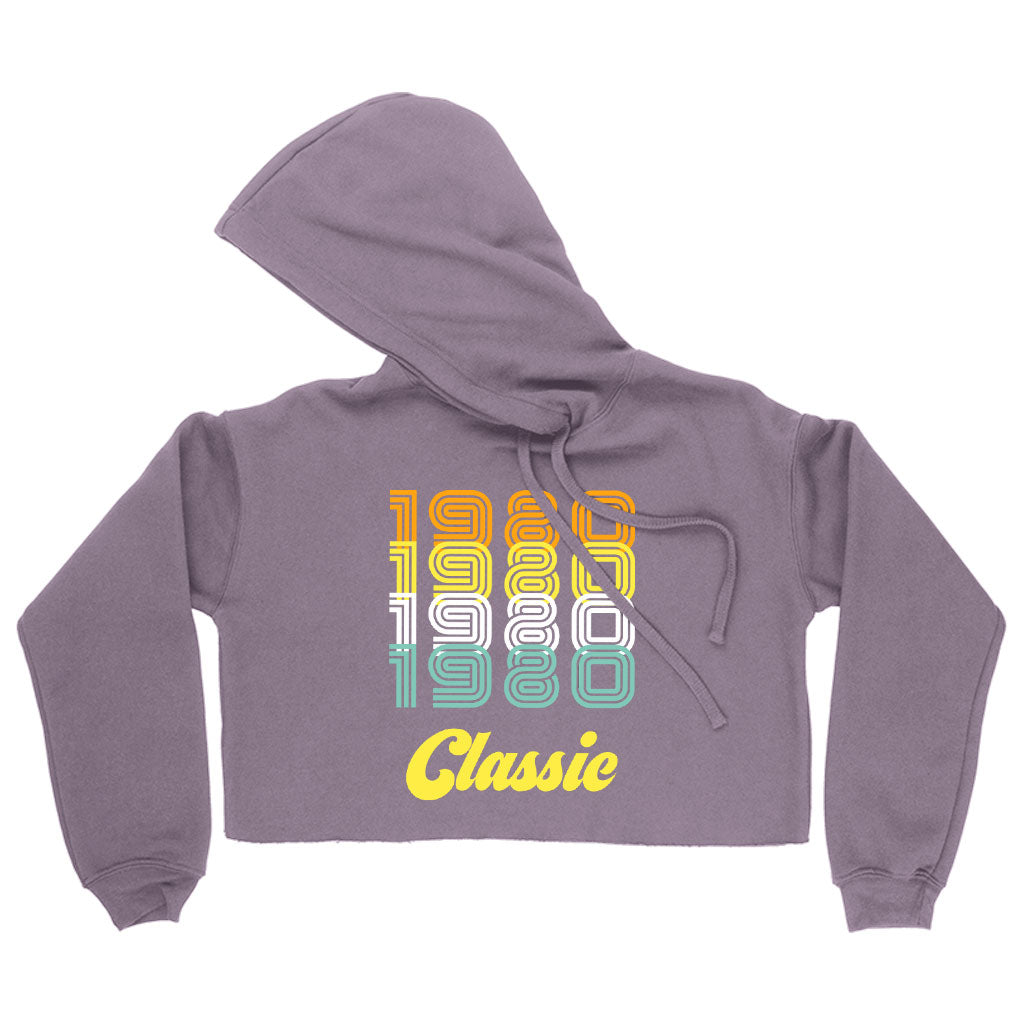 Women's Cropped Fleece 1980 Classic Hoodie in a stylish cropped design, showcasing its soft fleece material and relaxed fit.