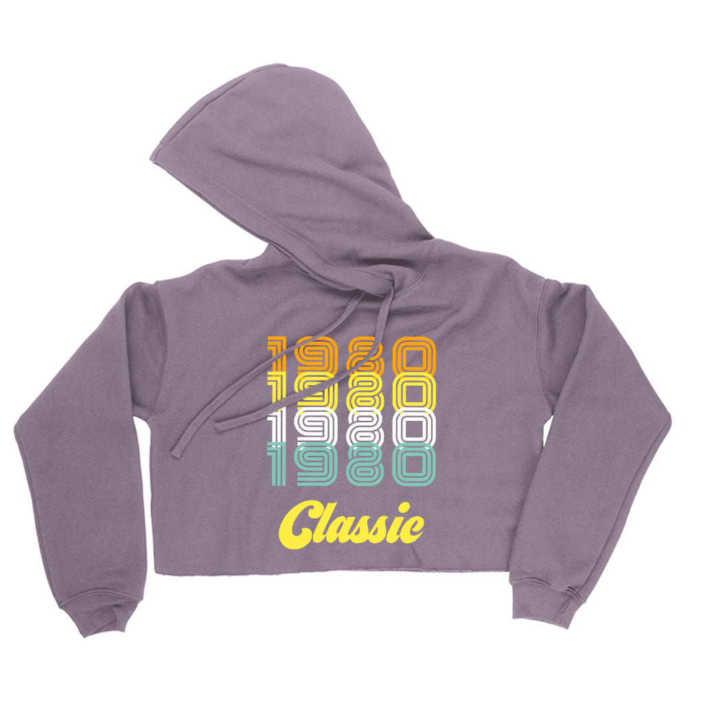 Women's Cropped Fleece 1980 Classic Hoodie in a stylish cropped design, showcasing its soft fleece material and relaxed fit.