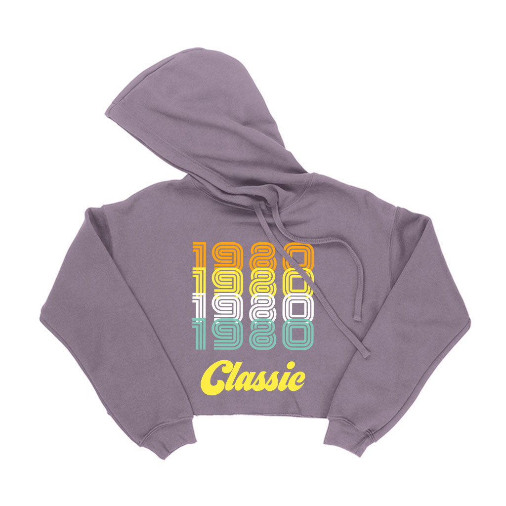 Women's Cropped Fleece 1980 Classic Hoodie in a stylish cropped design, showcasing its soft fleece material and relaxed fit.