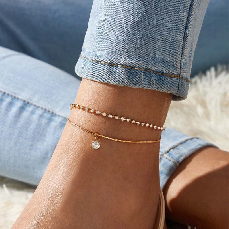 Elegant Women's Summer Anklet in 18K gold plating with gemstones, showcasing its adjustable design and luxurious shine.