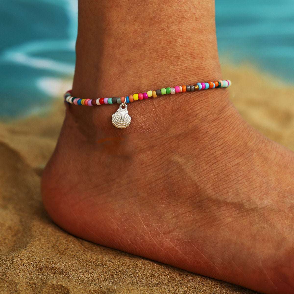 Elegant Women's Summer Anklet in 18K gold plating with gemstones, showcasing its adjustable design and luxurious shine.