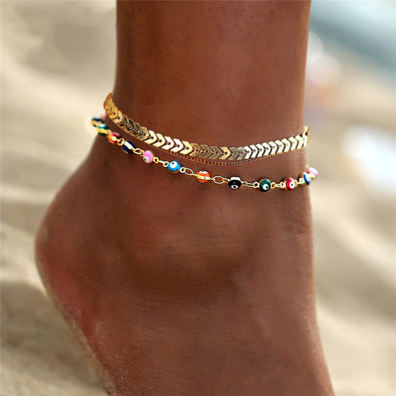 Elegant Women's Summer Anklet in 18K gold plating with gemstones, showcasing its adjustable design and luxurious shine.