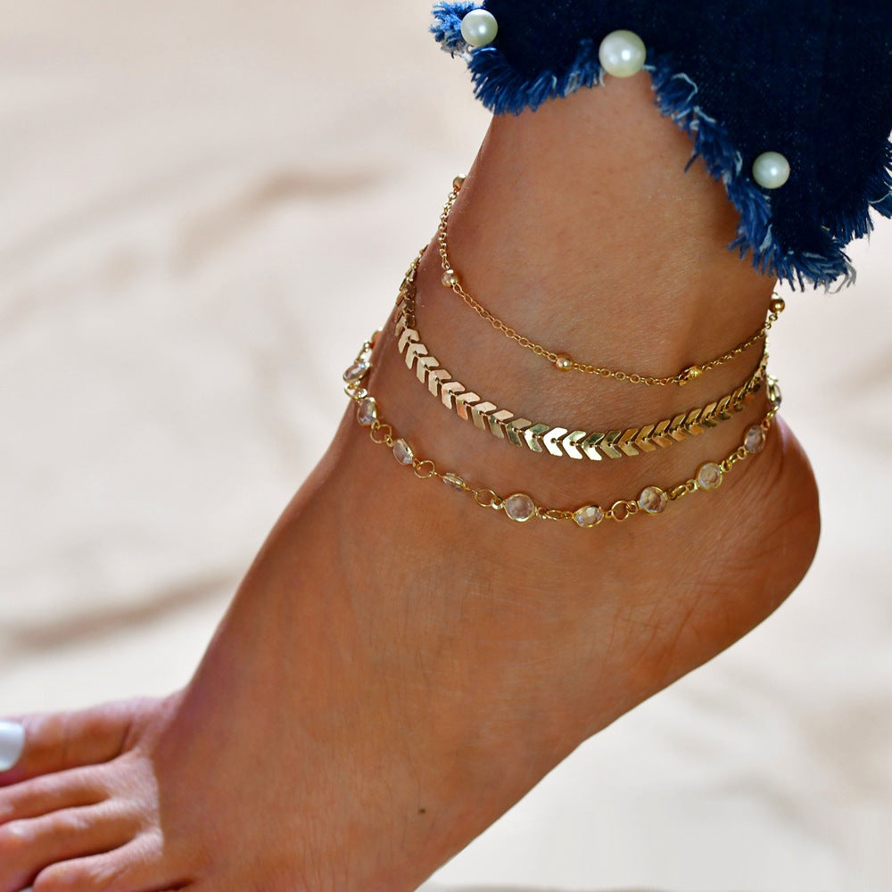 Elegant Women's Summer Anklet in 18K gold plating with gemstones, showcasing its adjustable design and luxurious shine.